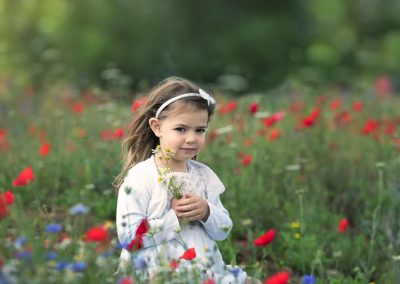 little girl in a flower field