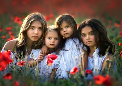 four girls in a poppy field in essex